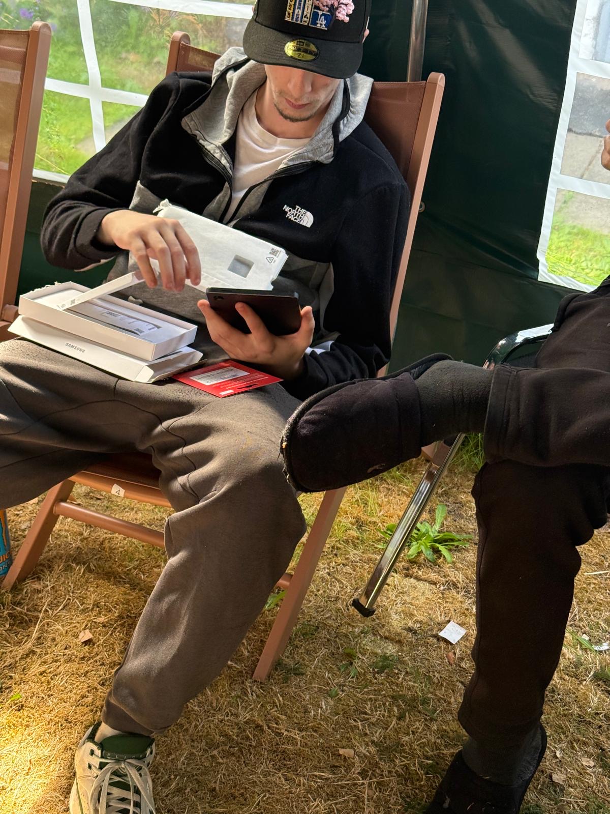Young person with digital tablet from the St Basils delivery session